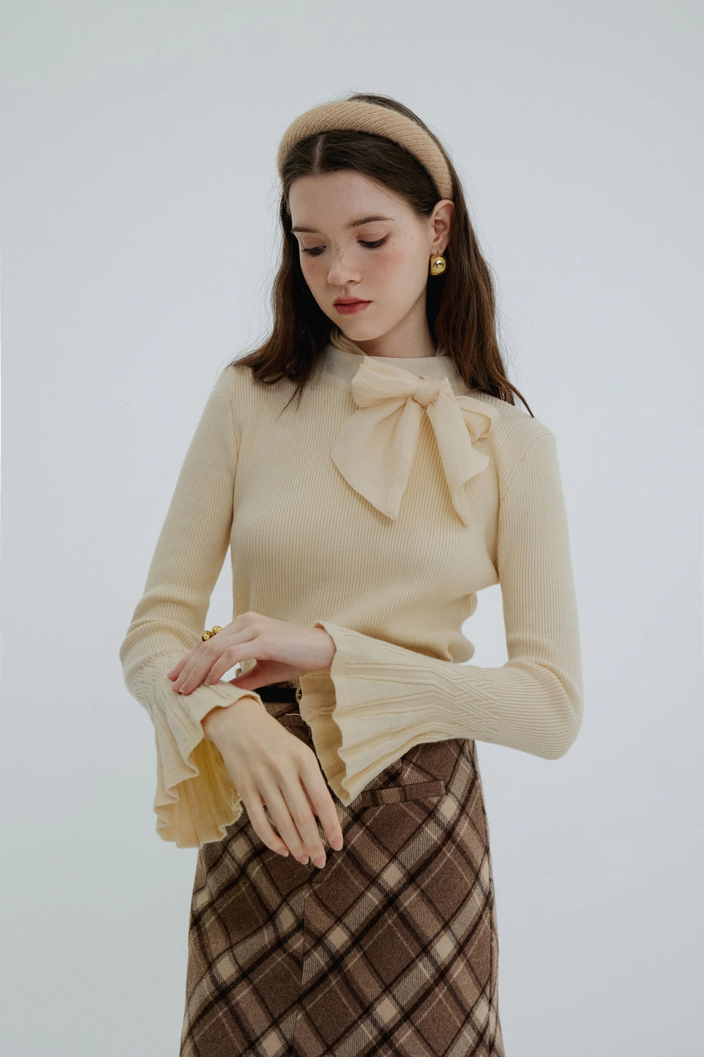 Pull tricoté col nœud féminin pour un look raffiné