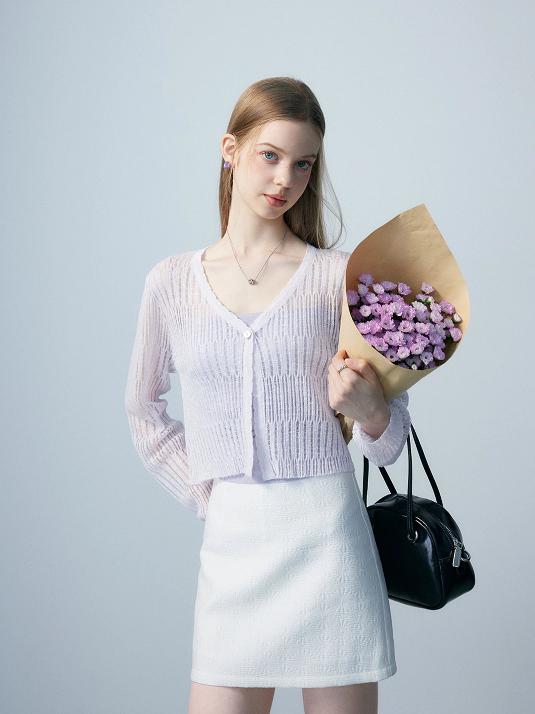 Cardigan en tricot léger et transparent pour femme