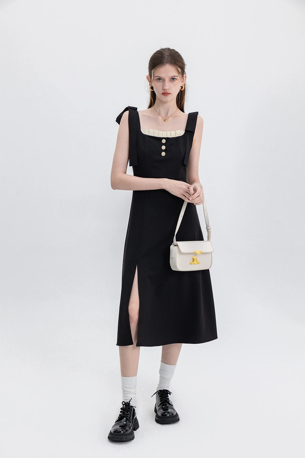 Sophisticated Black Dress with Button Accents and Shoulder Straps