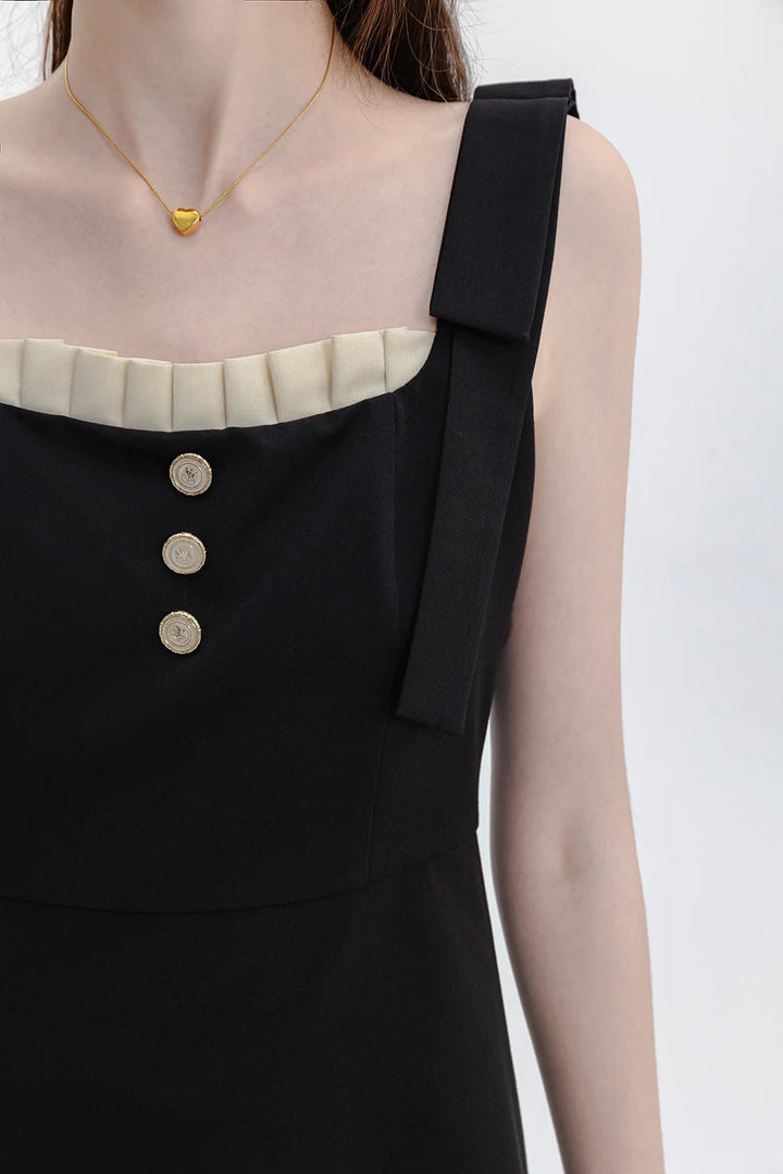 Sophisticated Black Dress with Button Accents and Shoulder Straps