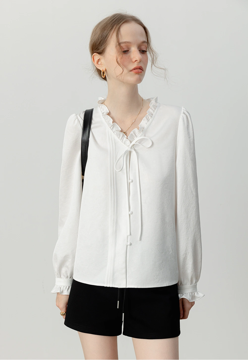 Women's Ruffled White Blouse with Bow Tie Detail