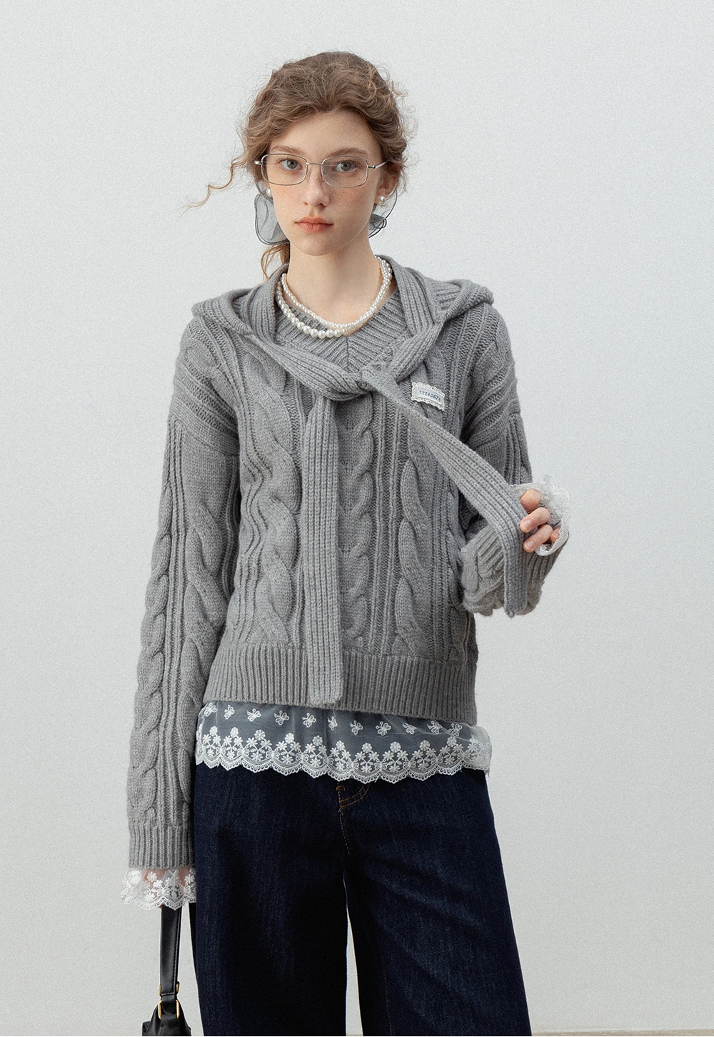 Women's Cable Knit Sweater with Lace Hem and Tie Neck