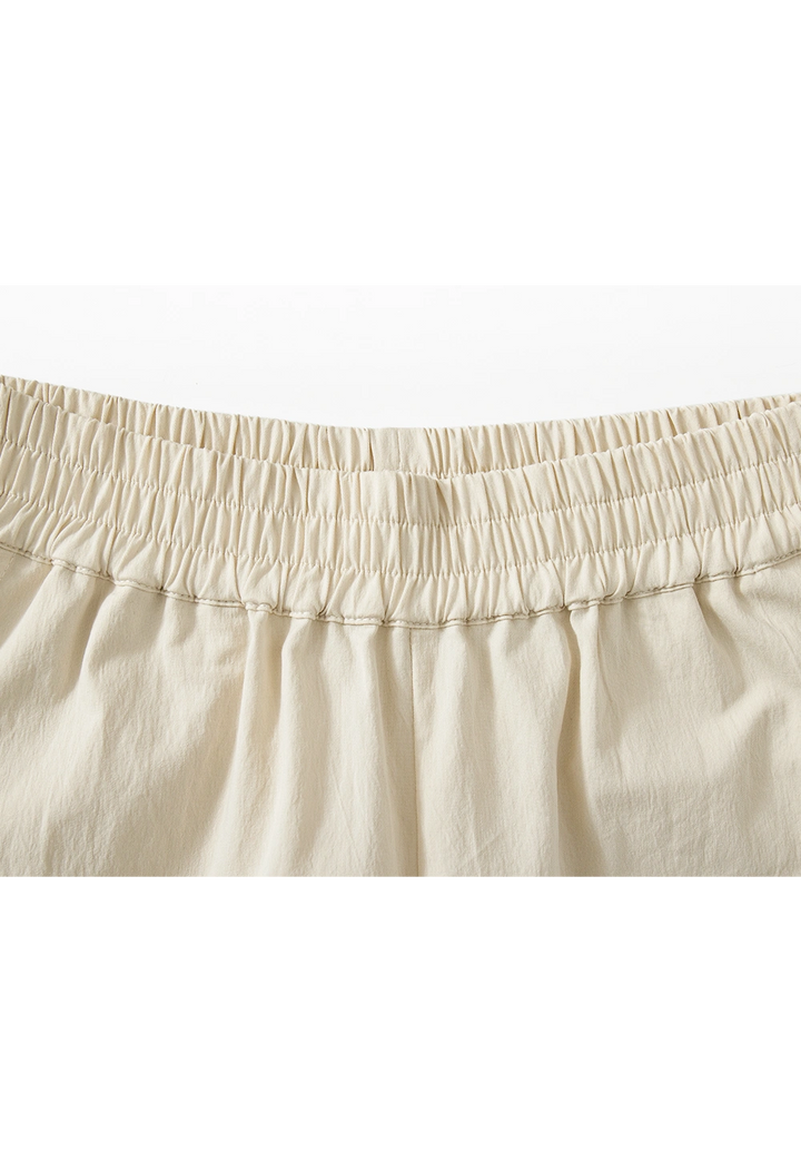 Pantalones anchos beige para mujer