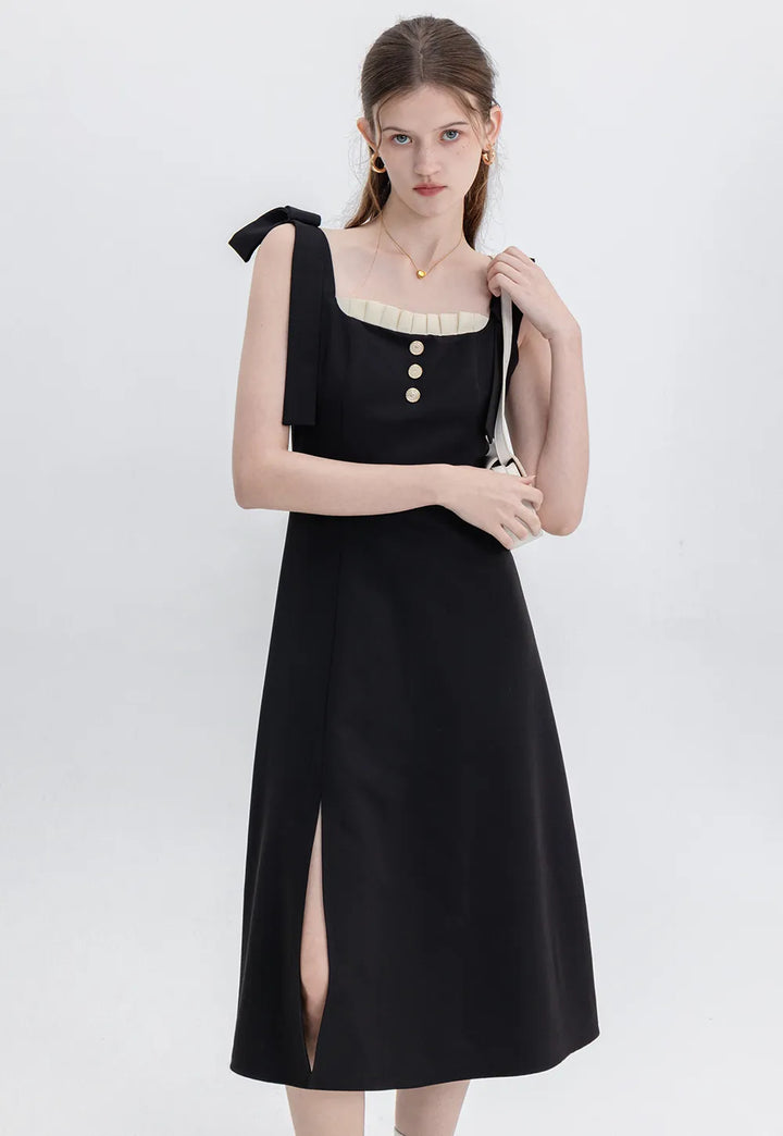 Sophisticated Black Dress with Button Accents and Shoulder Straps